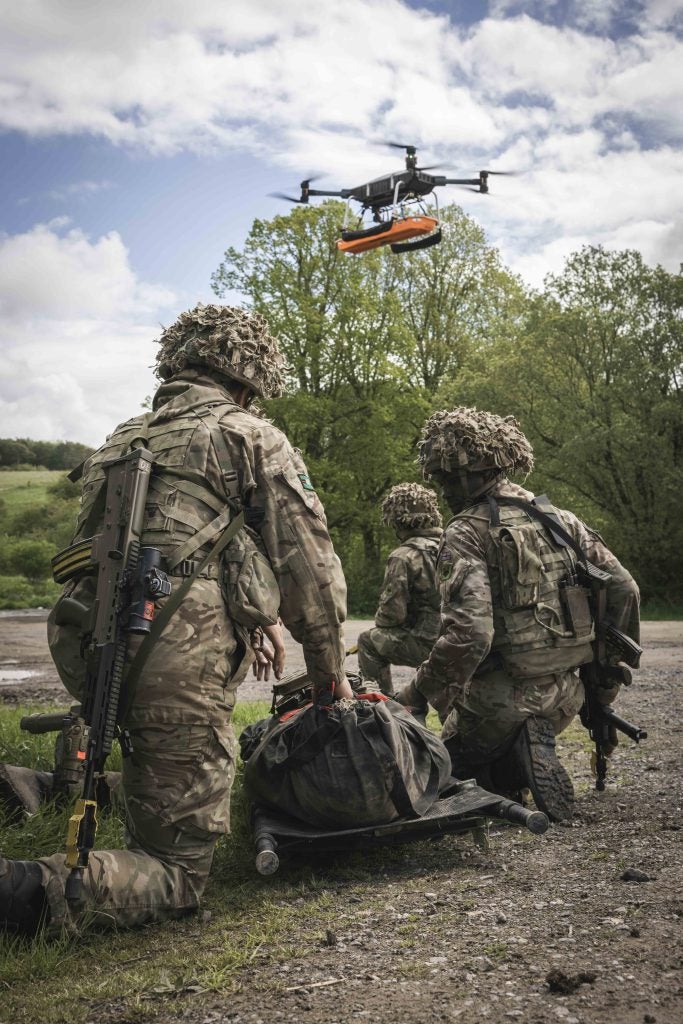 Troops from the NGCT wait with a casualty dummy to be lifted off by a by a Heavy Lift Drone during exercise Wessex Storm. Photo by Corporal Nathan Tanuku / UK MOD © Crown Copyright 2023, MOD News Licence.