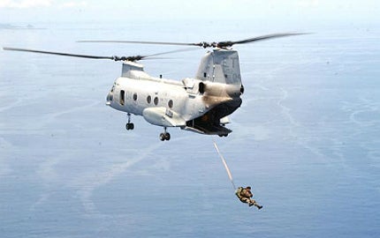 A US Army soldier performs a static jump