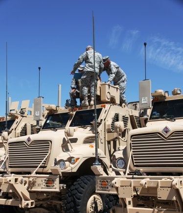 US Army personnel integrate vehicles